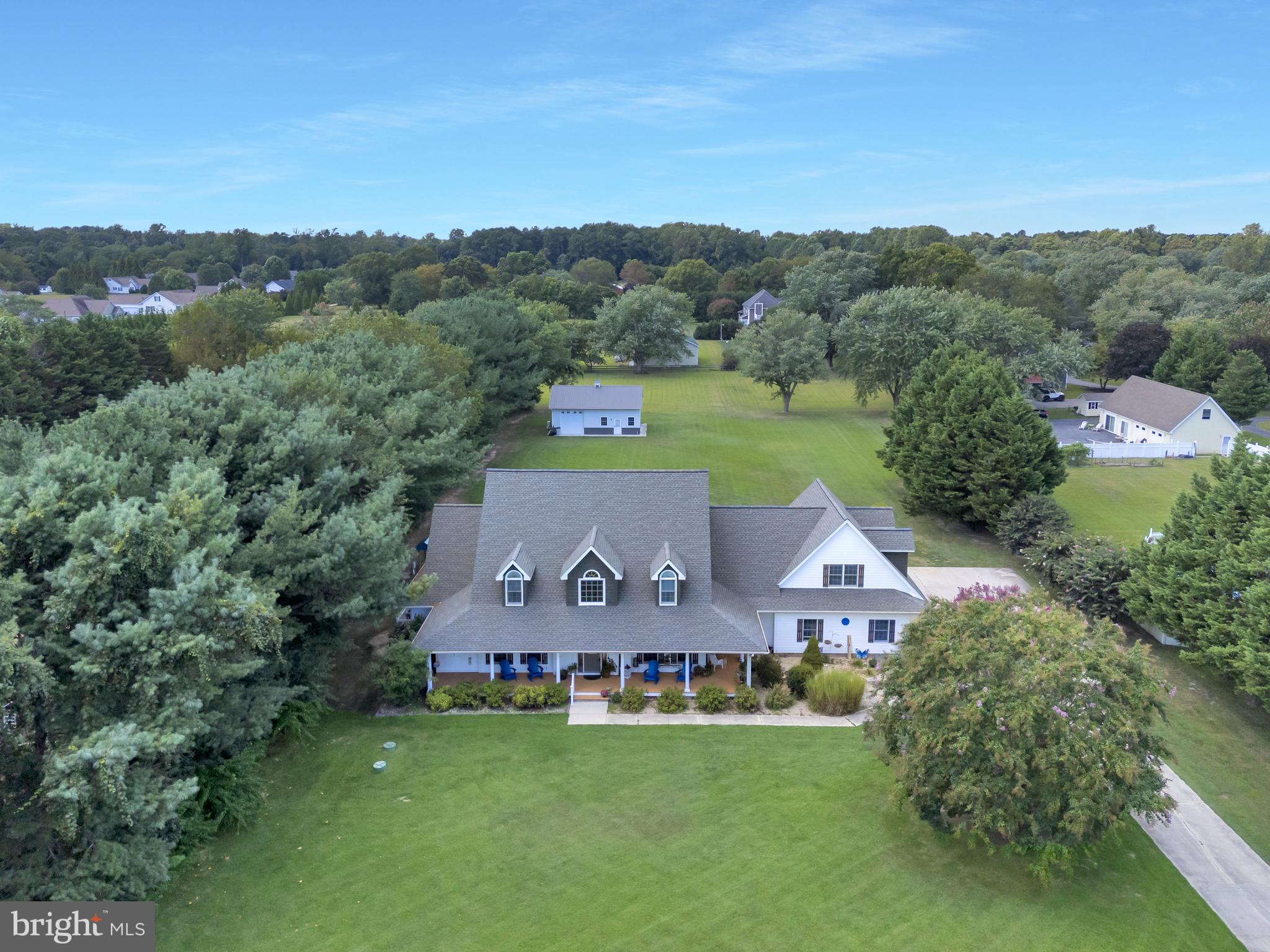 an aerial view of a house with a garden