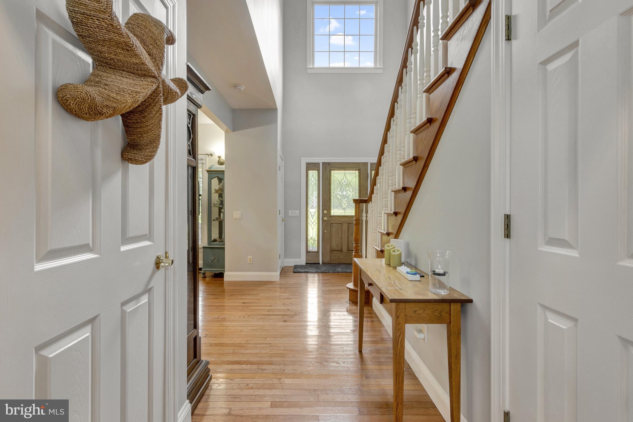 16132 Hudson Road Milton, DE 19968 - Photo 13 of 108 a view of an entryway with wooden floor and staircase