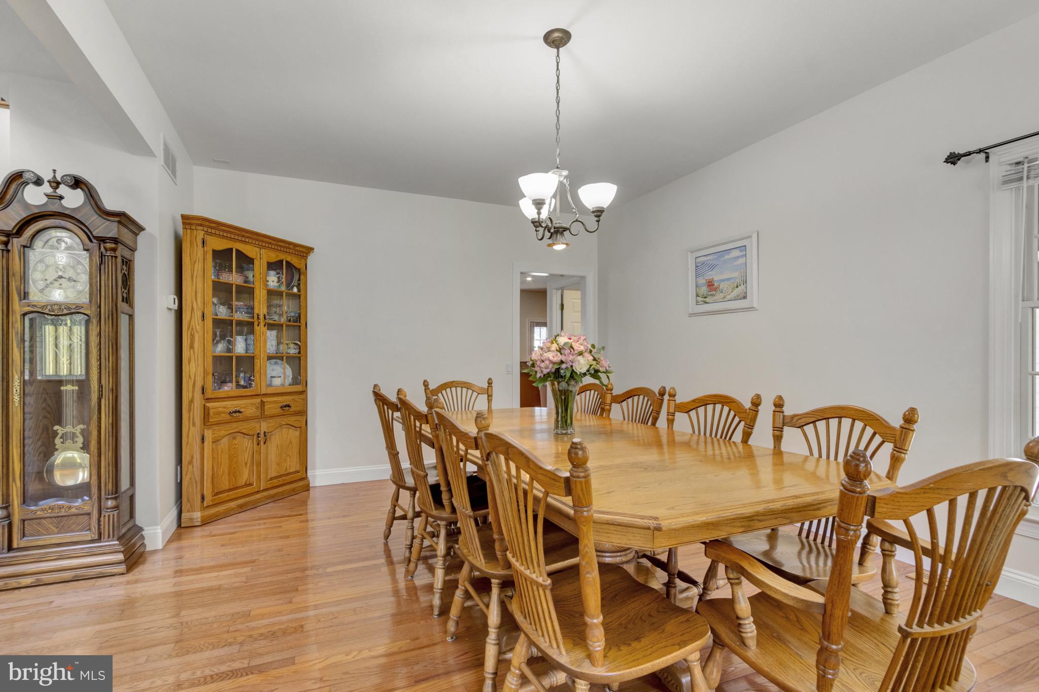 16132 Hudson Road Milton, DE 19968 - Photo 17 of 108 a view of a dining room with furniture wooden floor and a chandelier