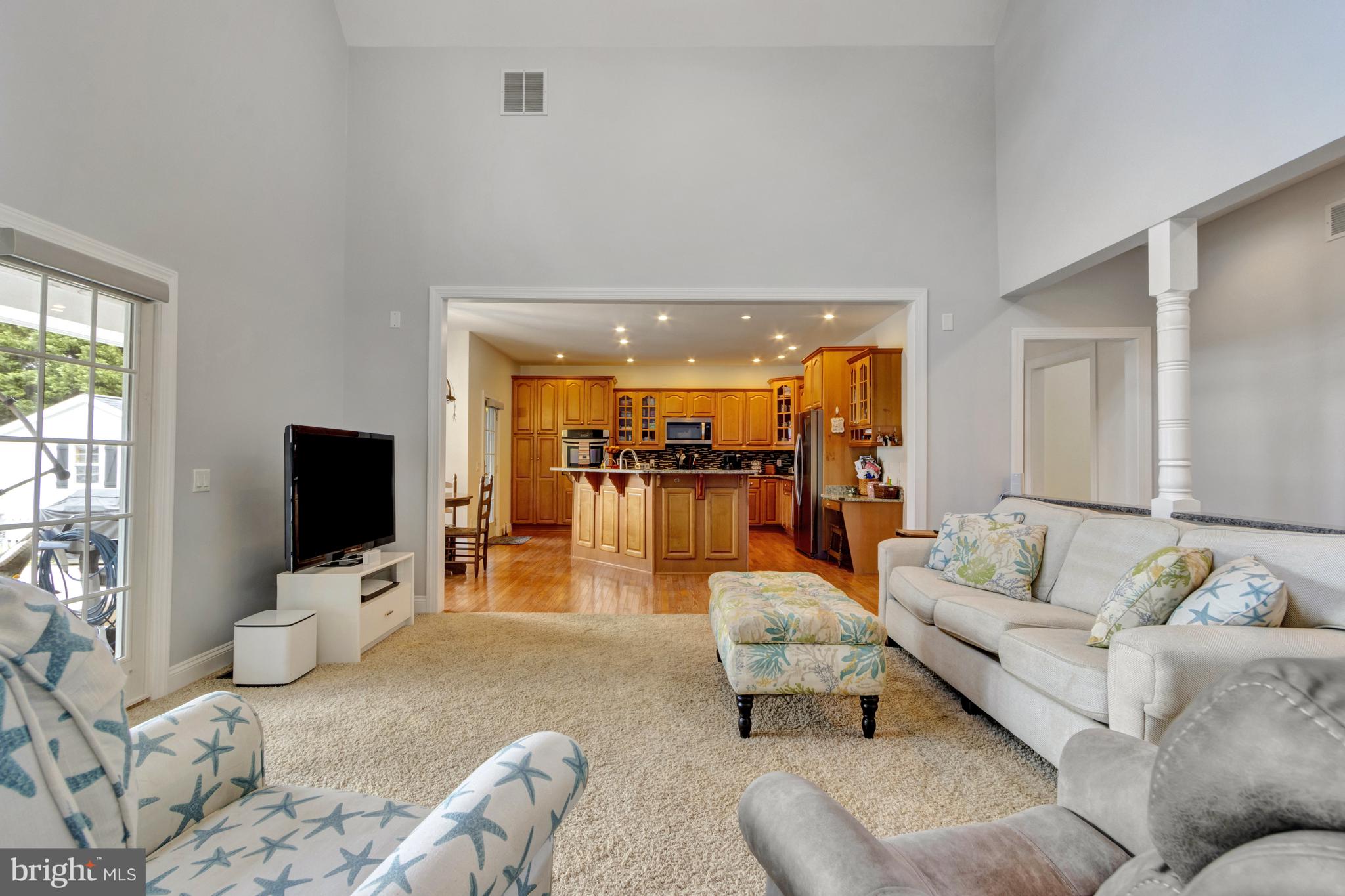 16132 Hudson Road Milton, DE 19968 - Photo 34 of 108 a living room with furniture and a flat screen tv