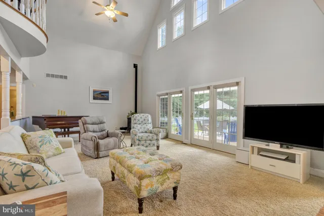 a bathroom with a granite countertop sink a mirror and shower