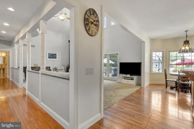 an aerial view of residential houses with outdoor space and swimming pool
