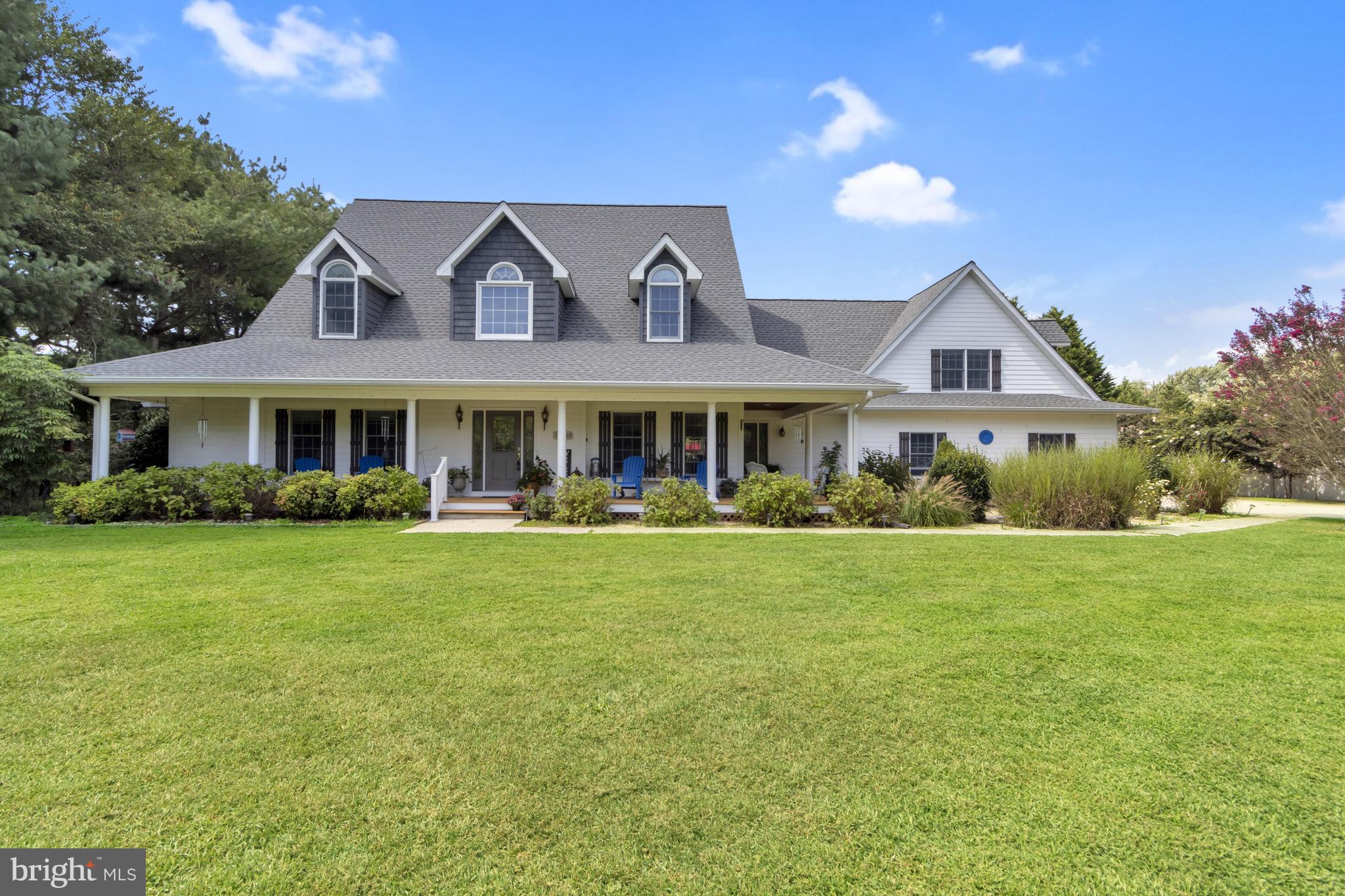 16132 Hudson Road Milton, DE 19968 - Photo 5 of 108 a front view of a house with a garden
