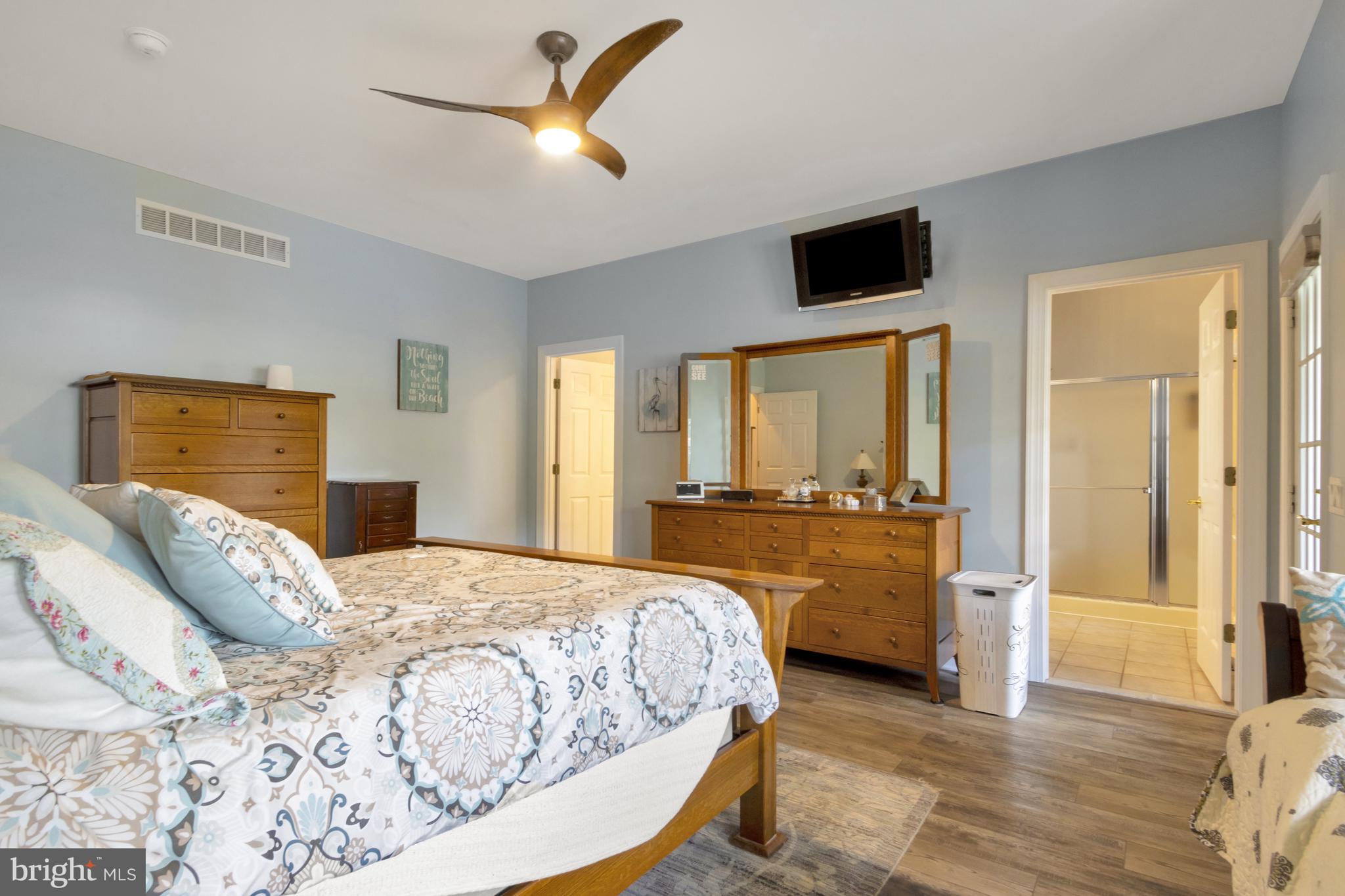 16132 Hudson Road Milton, DE 19968 - Photo 51 of 108 a bedroom with a bed and a flat screen tv