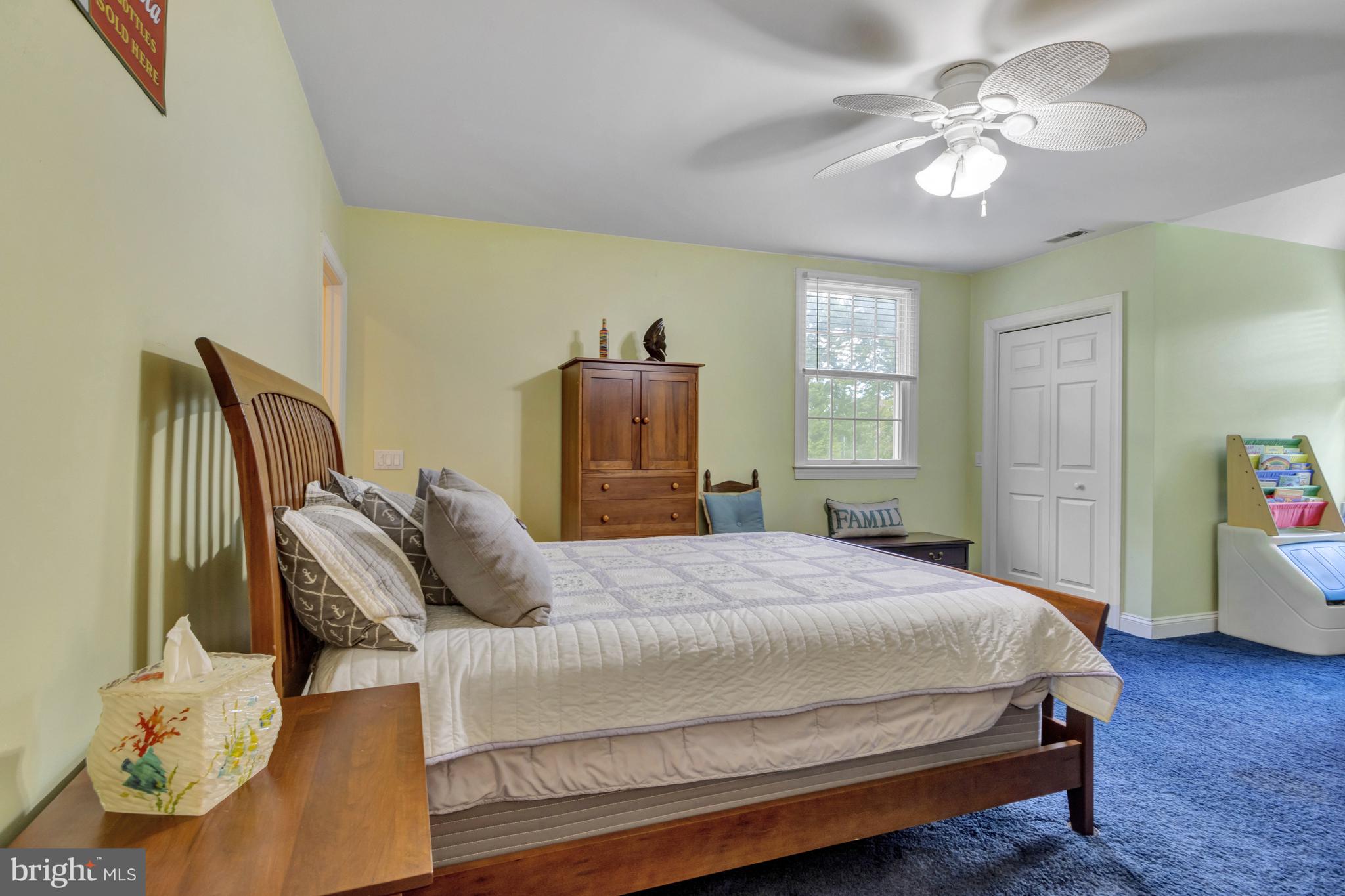 16132 Hudson Road Milton, DE 19968 - Photo 65 of 108 a bedroom with a bed and a chandelier