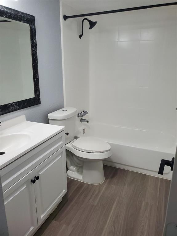 206 Springbranch Drive Garland, TX 75043 - Photo 9 of 12 a white toilet sitting next to a bathroom sink