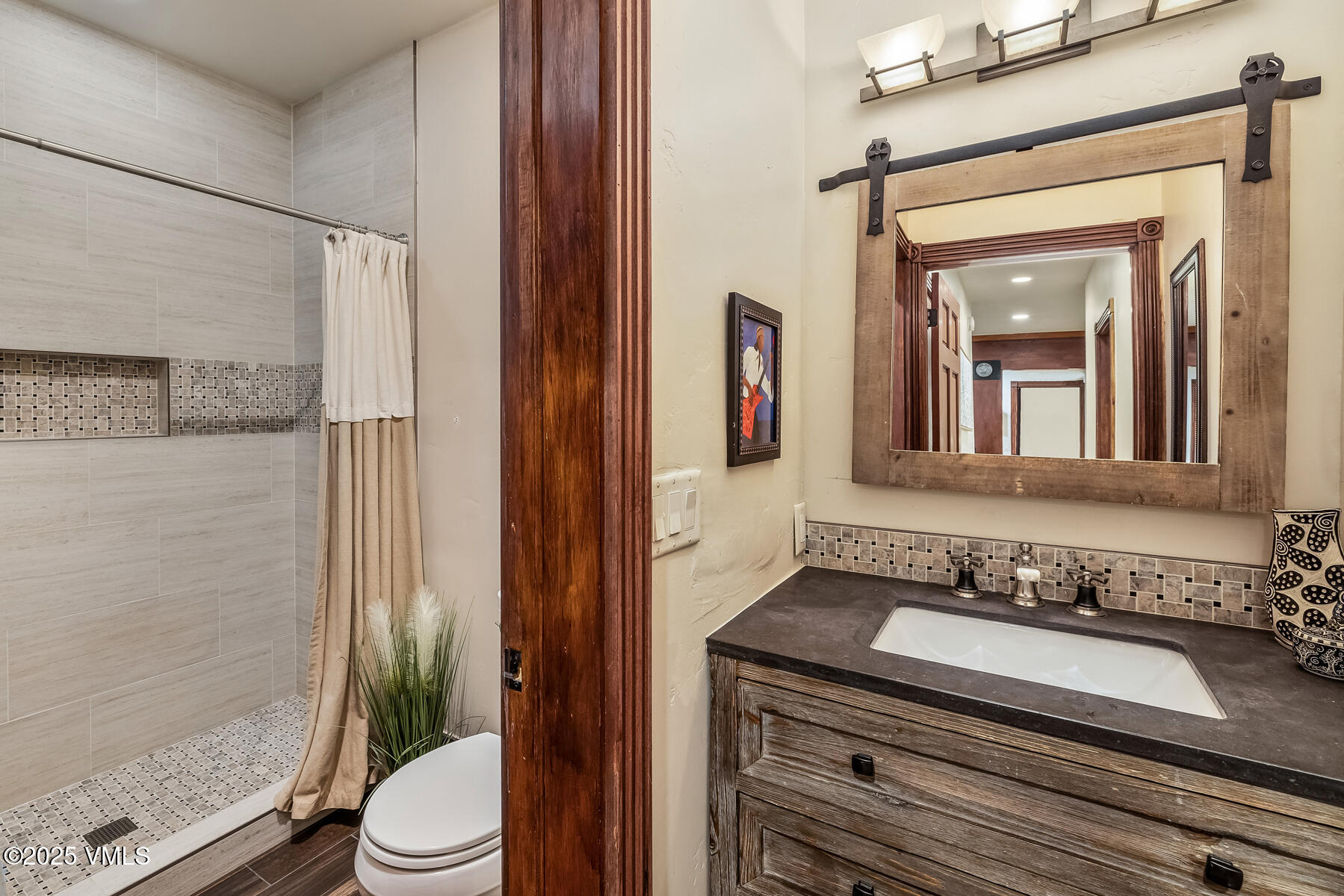 2010 Vermont Road Vail, CO 81657 - Photo 11 of 35 a bathroom with a granite countertop sink toilet and shower
