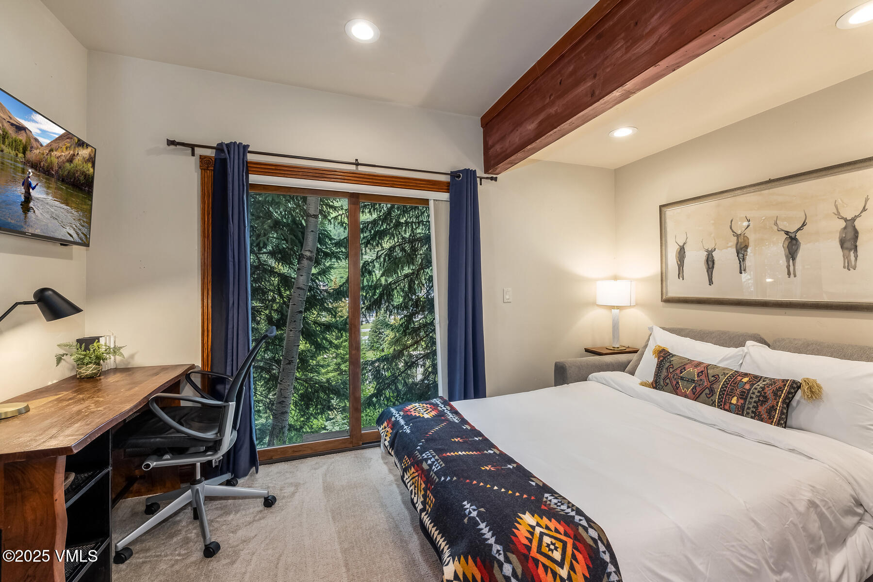 2010 Vermont Road Vail, CO 81657 - Photo 12 of 35 a bed sitting in a bedroom next to a window