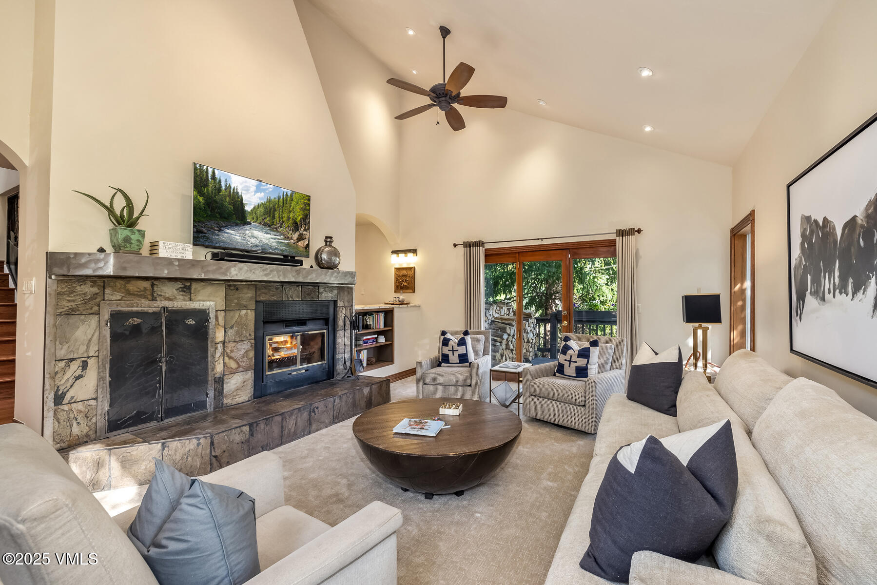 2010 Vermont Road Vail, CO 81657 - Photo 2 of 35 a living room with furniture and a fireplace
