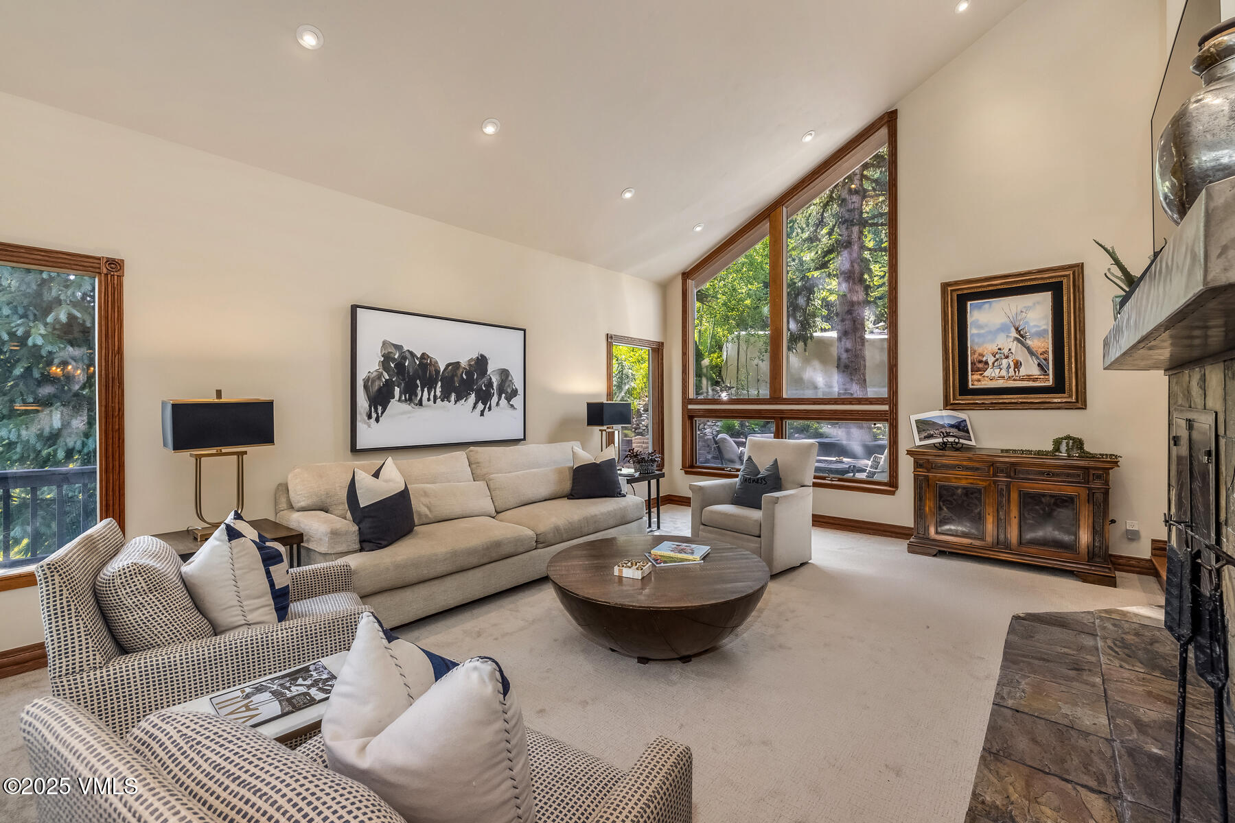 2010 Vermont Road Vail, CO 81657 - Photo 22 of 35 a living room with furniture large window and a fireplace