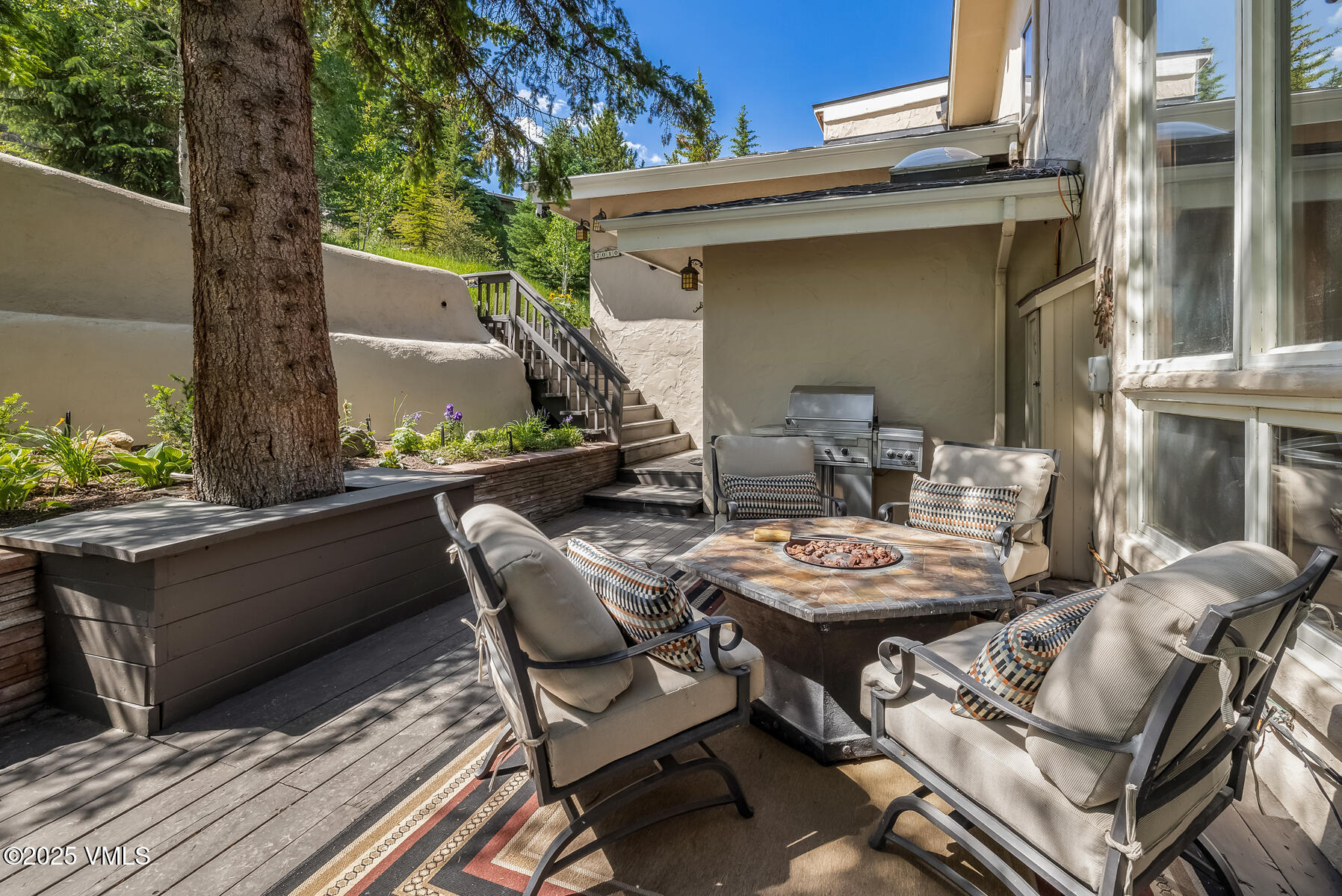 2010 Vermont Road Vail, CO 81657 - Photo 34 of 35 a backyard of a house with outdoor seating