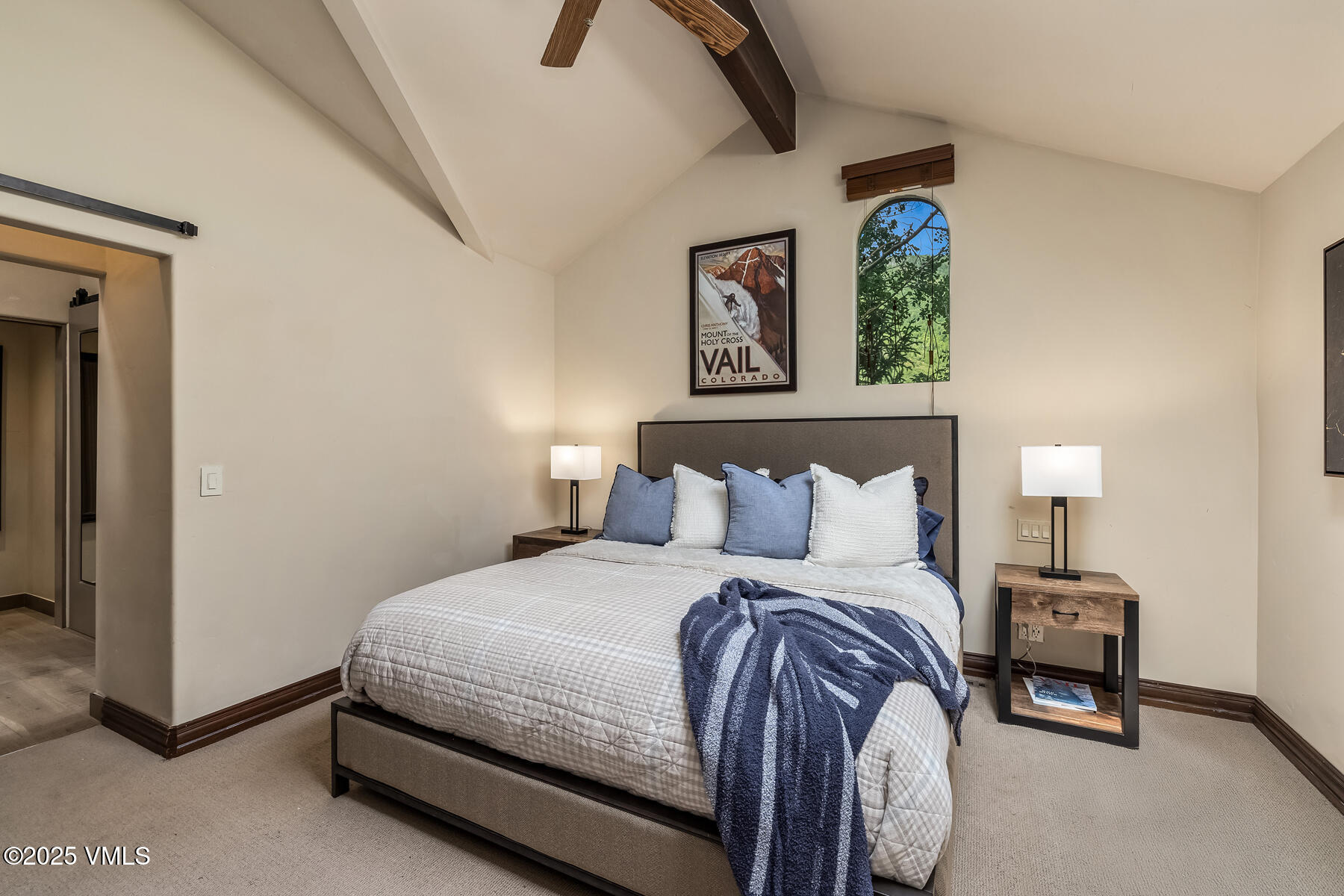 2010 Vermont Road Vail, CO 81657 - Photo 5 of 35 a bedroom with a bed and a chandelier