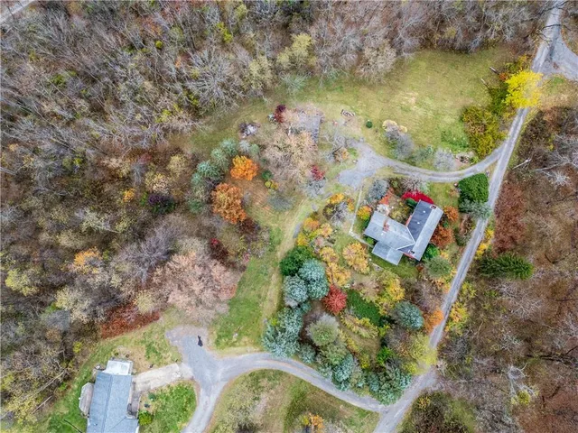 an aerial view of residential houses with outdoor space