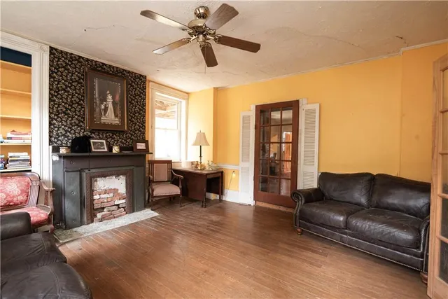 a living room with furniture and a fireplace