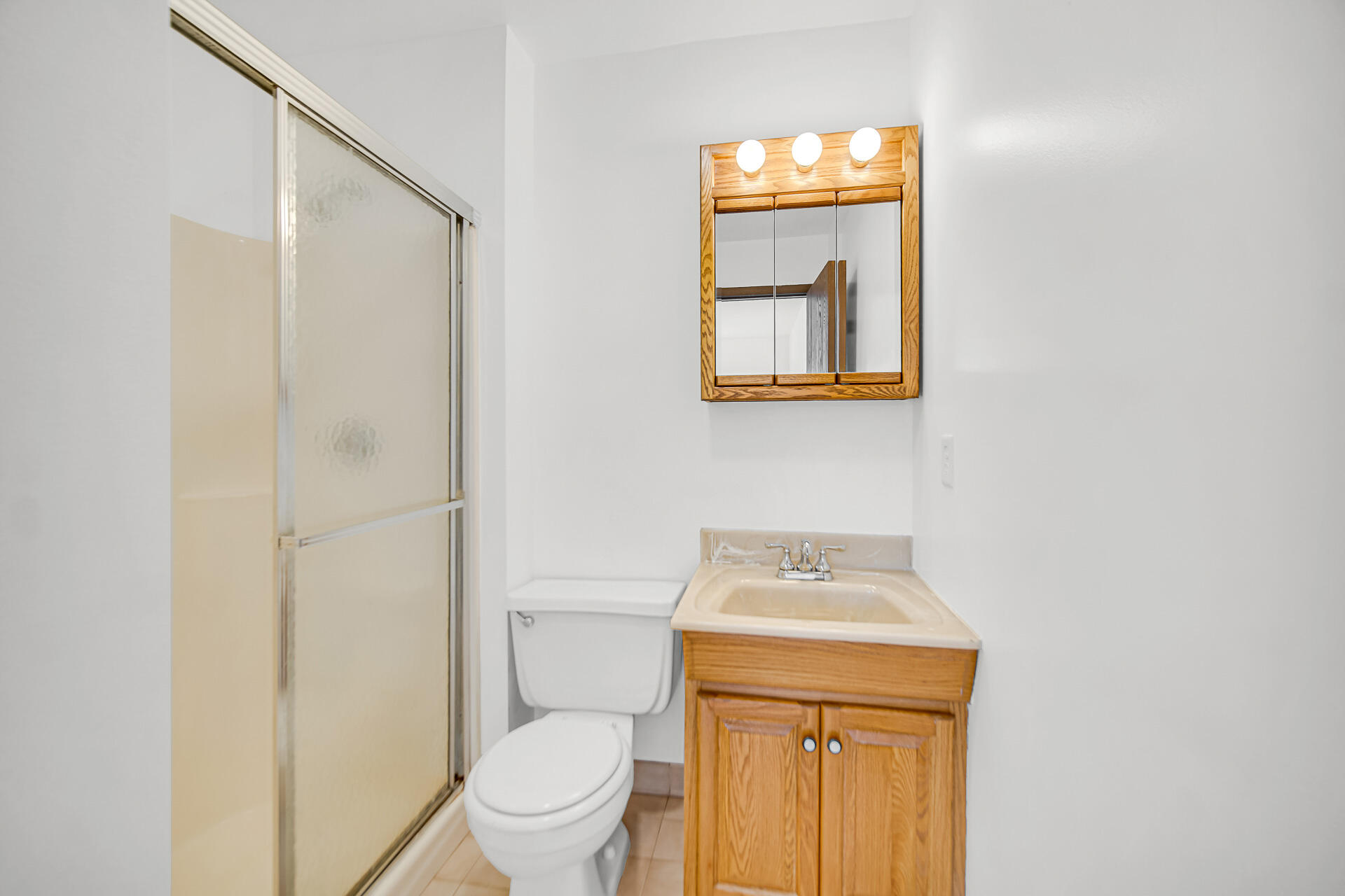 2114 Tupelo Lane Chesterton, IN 46304 - Photo 18 of 23 a bathroom with a sink a toilet and a mirror