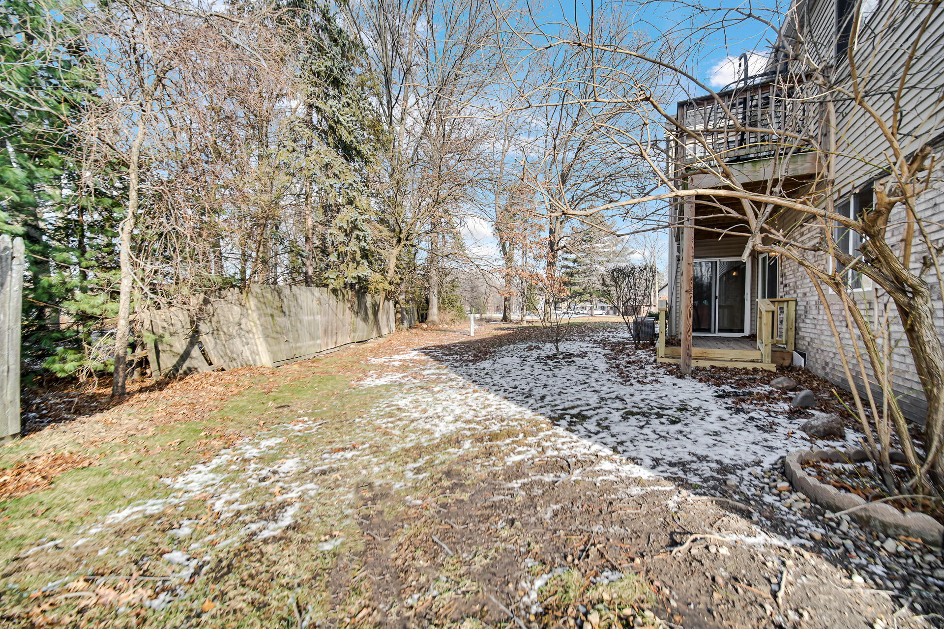 2114 Tupelo Lane Chesterton, IN 46304 - Photo 2 of 23 a view of a yard with plants and trees
