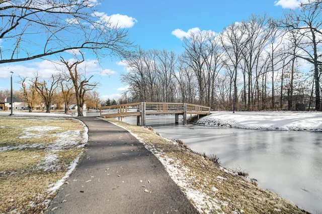 a view of a swimming pool with an outdoor space and seating area