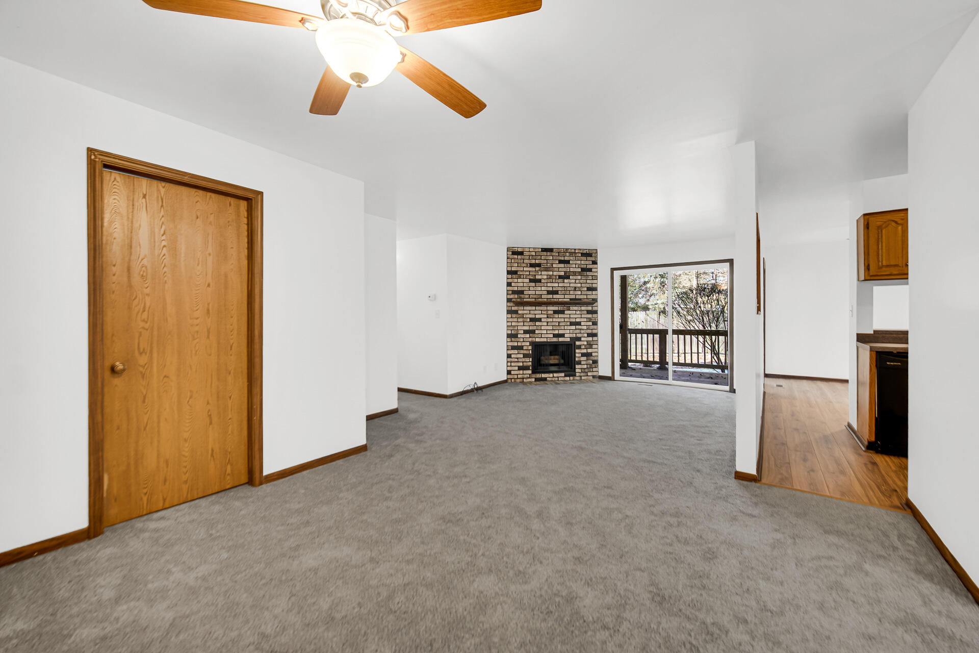 2114 Tupelo Lane Chesterton, IN 46304 - Photo 5 of 23 a view of empty room with fireplace and fan