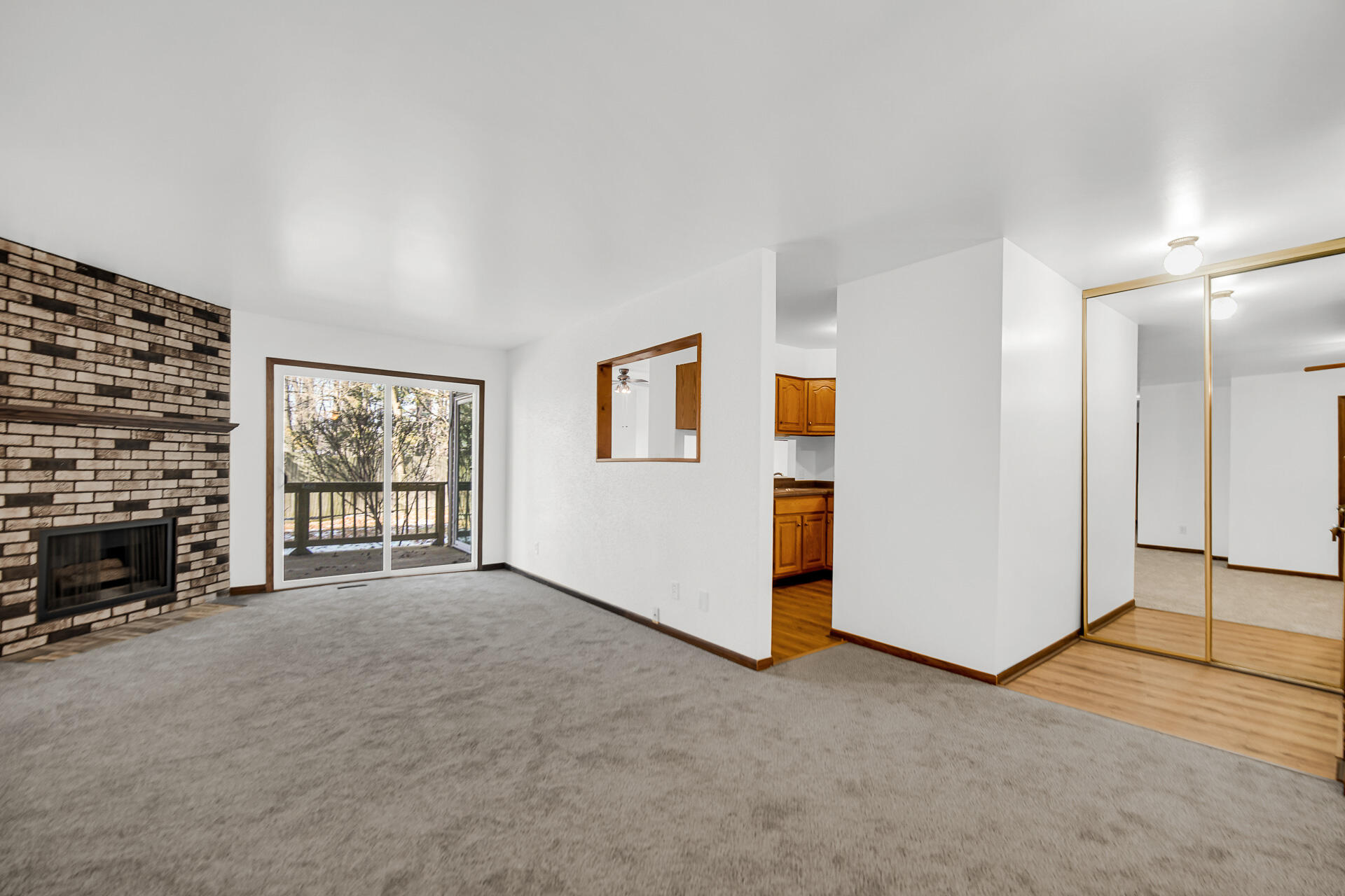2114 Tupelo Lane Chesterton, IN 46304 - Photo 6 of 23 a view of an empty room with fireplace and a window