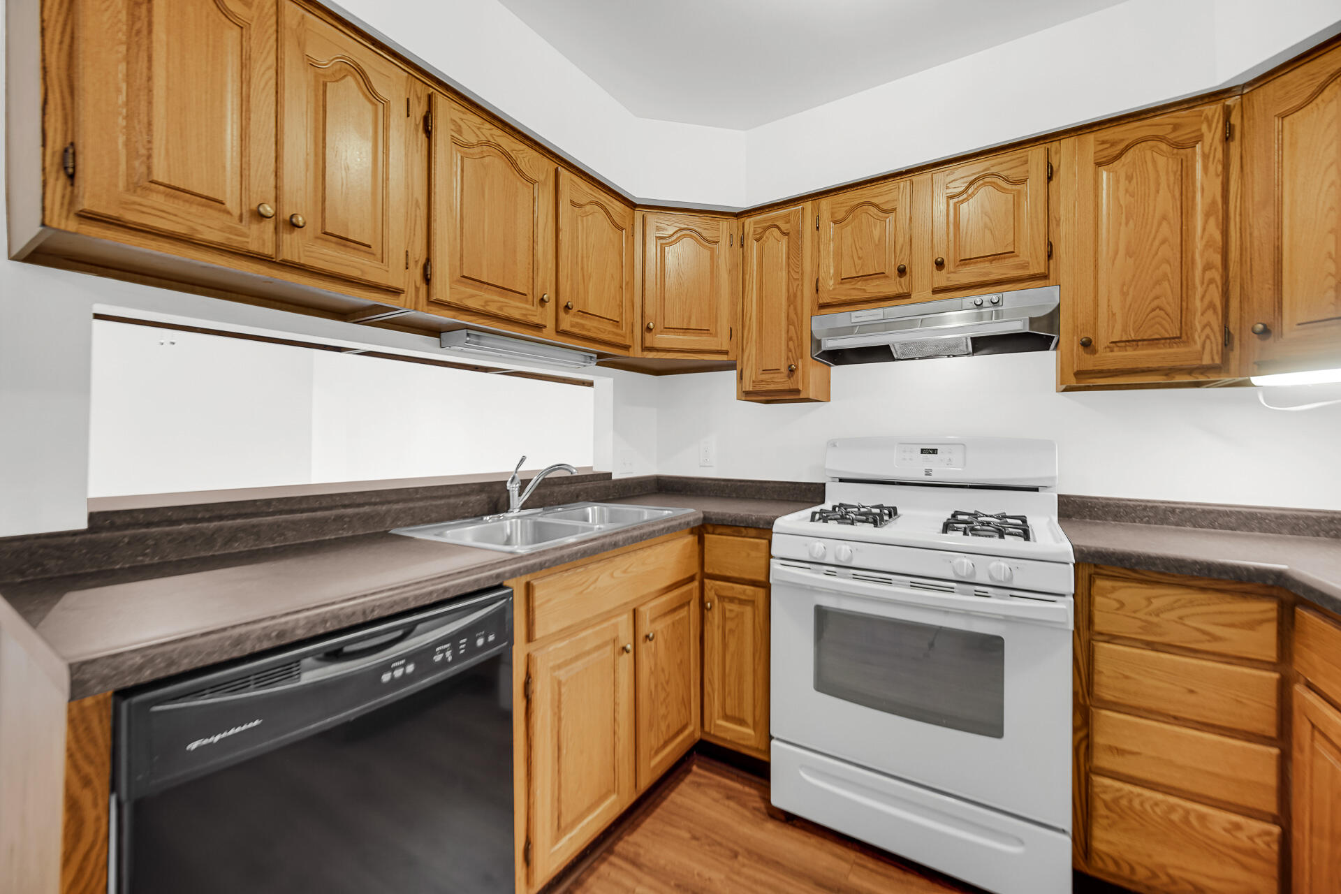 2114 Tupelo Lane Chesterton, IN 46304 - Photo 9 of 23 a kitchen with stainless steel appliances granite countertop a stove a sink and cabinets