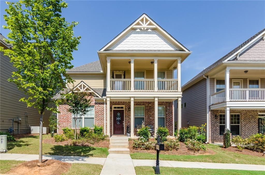 449 Privet Circle Suwanee, GA 30024 - Photo 1 of 9 front view of a brick house with a yard