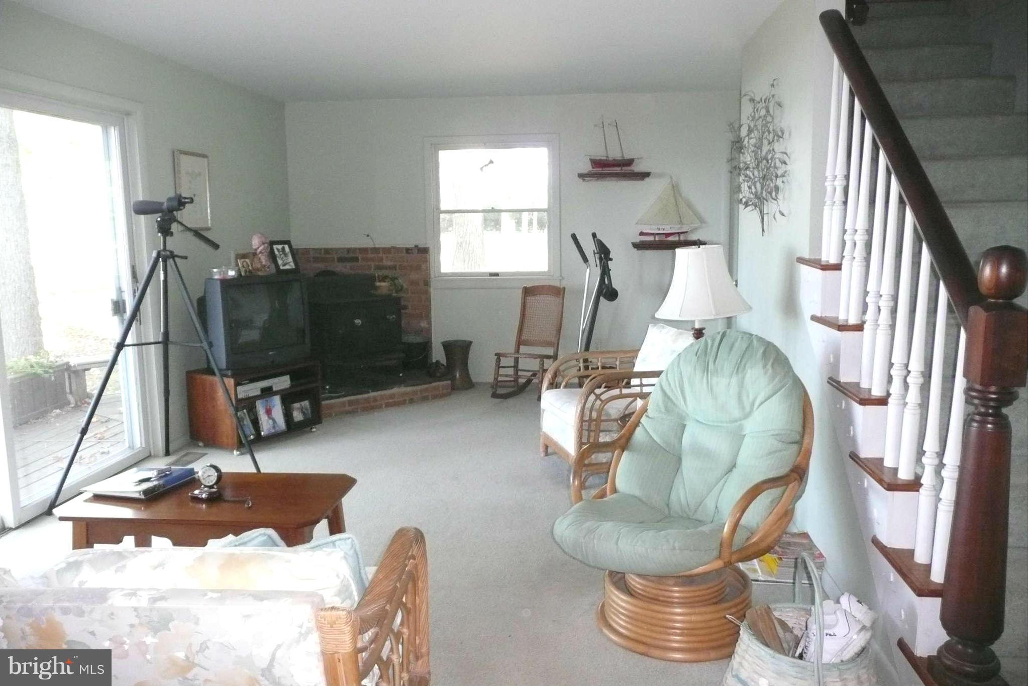 5936 Horns Point Road Cambridge, MD 21613 - Photo 13 of 30 Living Room with wood stove