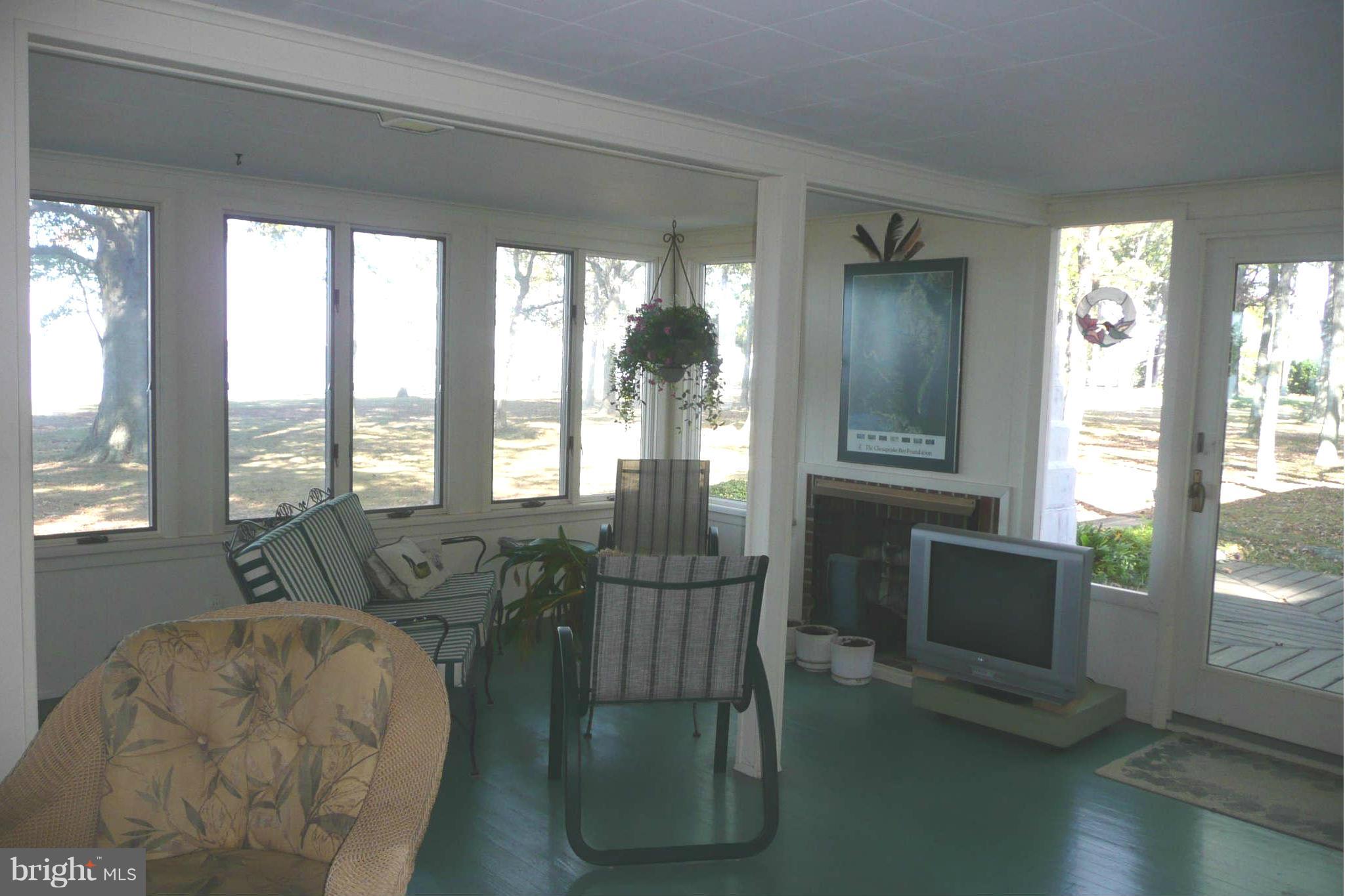 5936 Horns Point Road Cambridge, MD 21613 - Photo 14 of 30 Sunroom with gas fireplace