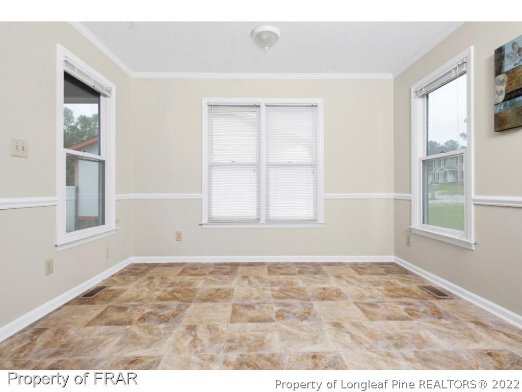 6549 Rhemish Drive Fayetteville, NC 28304 - Photo 13 of 27 a view of an empty room with a window