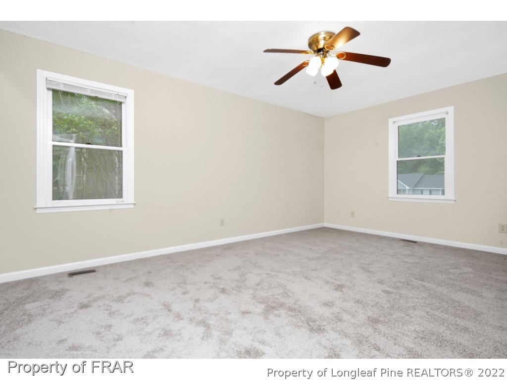 6549 Rhemish Drive Fayetteville, NC 28304 - Photo 16 of 27 a view of an empty room with a window
