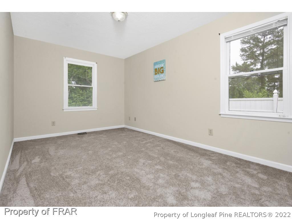 6549 Rhemish Drive Fayetteville, NC 28304 - Photo 20 of 27 an empty room with windows