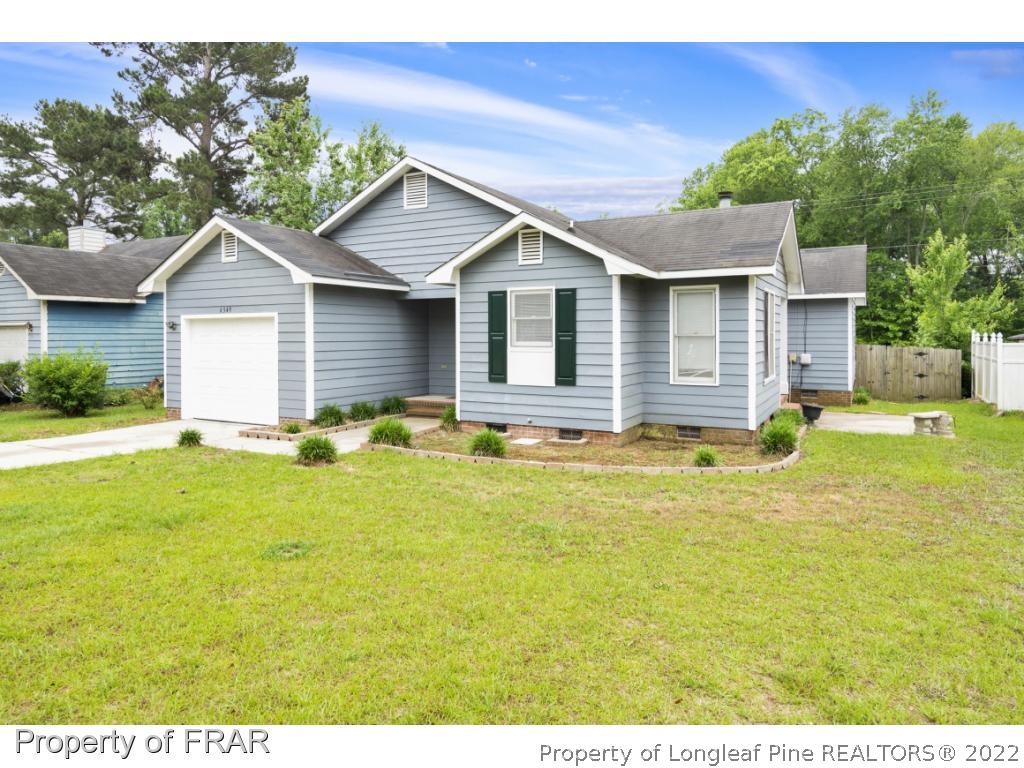 6549 Rhemish Drive Fayetteville, NC 28304 - Photo 27 of 27 a view of a house with a yard