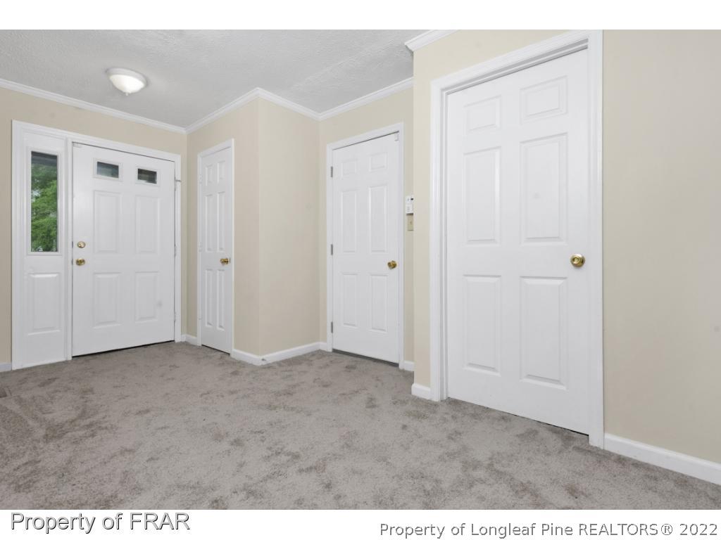 6549 Rhemish Drive Fayetteville, NC 28304 - Photo 6 of 27 a view of an empty room and wooden floor