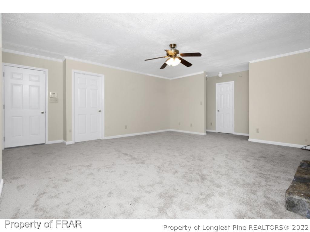 6549 Rhemish Drive Fayetteville, NC 28304 - Photo 9 of 27 a view of room with a ceiling fan
