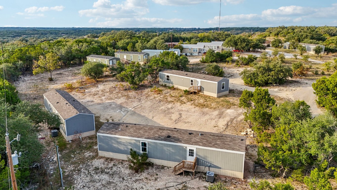 24369-2 Bingham Creek Road, Unit 8 Leander, TX 78641 - Photo 4 of 16 an aerial view of a house with a yard