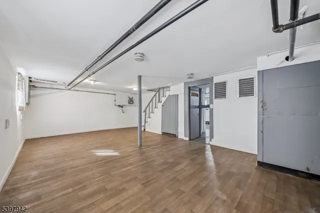 a view of an empty room with stairs