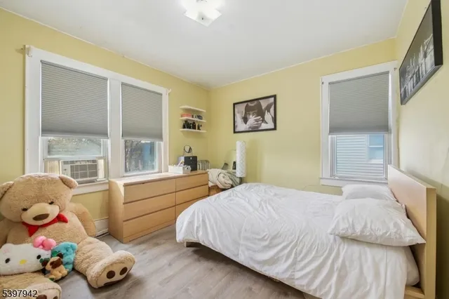 a bathroom with a tub a sink and a shower