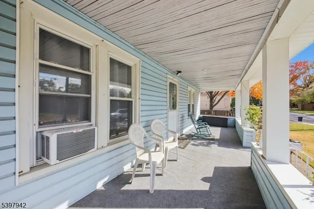 a view of a patio with table and chairs and potted plants