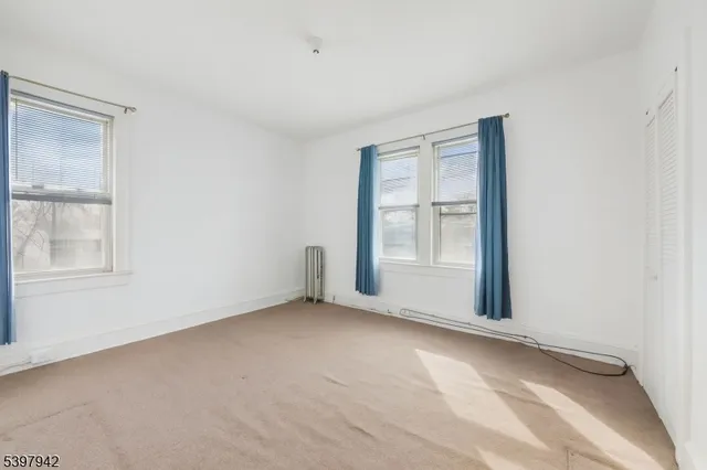 an empty room with entrance door