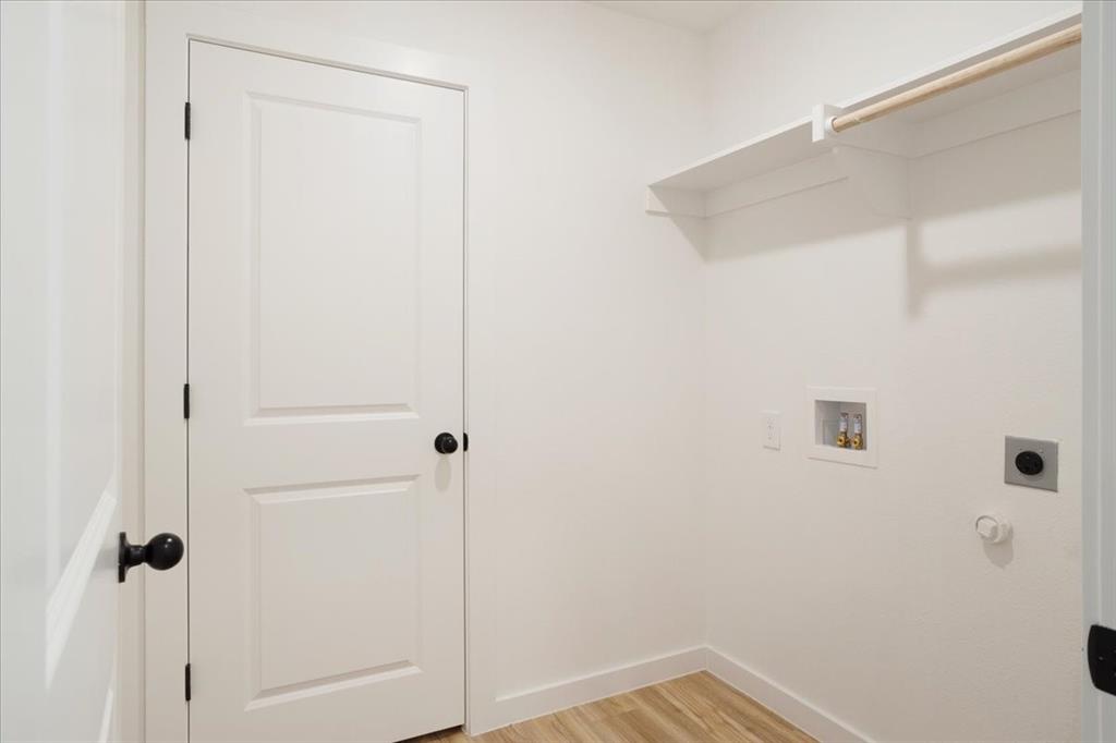 2408 Miller Street Denison, TX 75020 - Photo 12 of 26 a bathroom with a shower