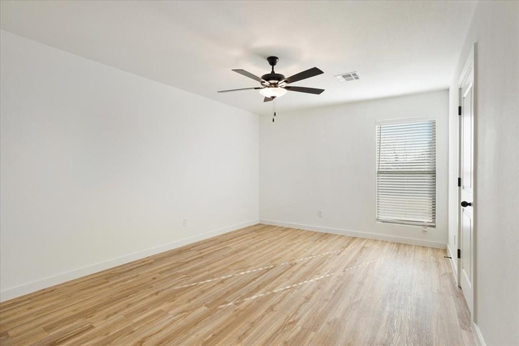 2408 Miller Street Denison, TX 75020 - Photo 13 of 26 wooden floor in an empty room