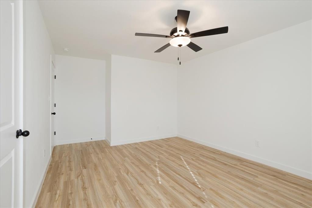 2408 Miller Street Denison, TX 75020 - Photo 15 of 26 a view of a room with wooden floor
