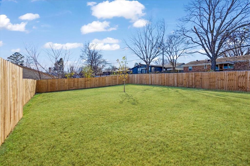 2408 Miller Street Denison, TX 75020 - Photo 26 of 26 a view of yard with swimming pool and green space