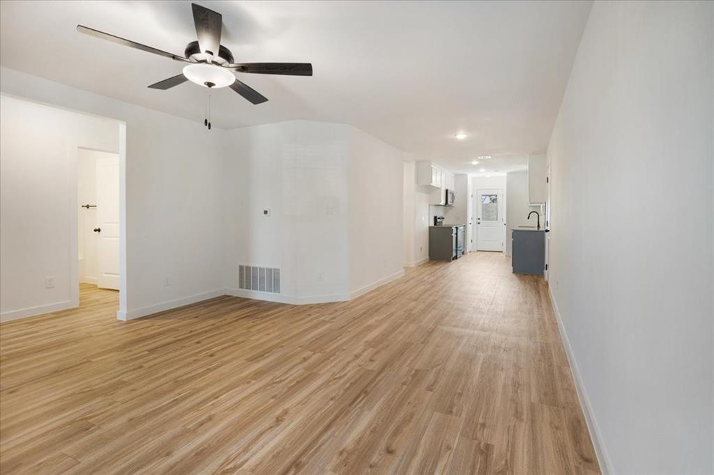 2408 Miller Street Denison, TX 75020 - Photo 6 of 26 a view of a livingroom with wooden floor