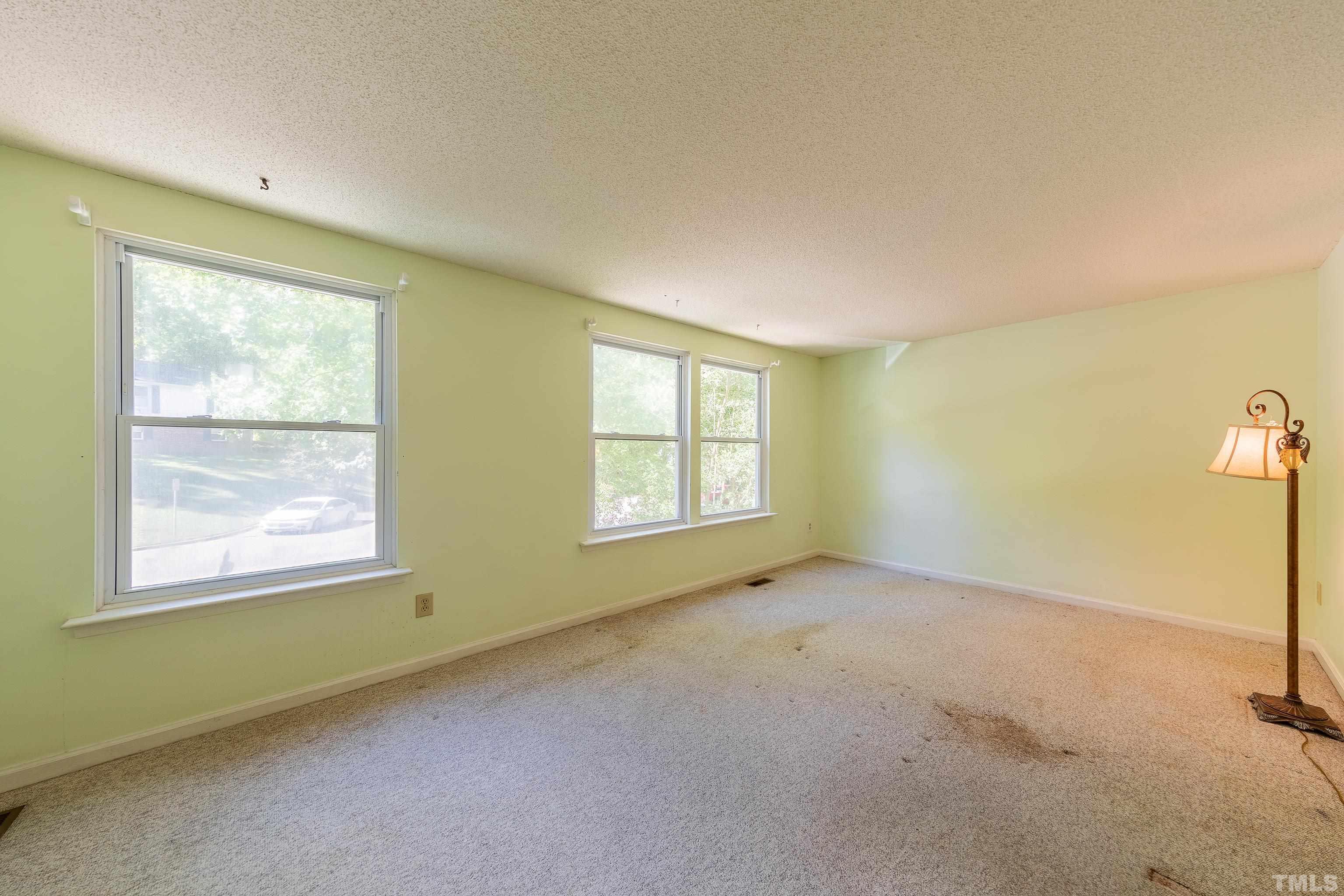 7328 Summerland Drive Raleigh, NC 27612 - Photo 15 of 22 a view of an empty room with a window