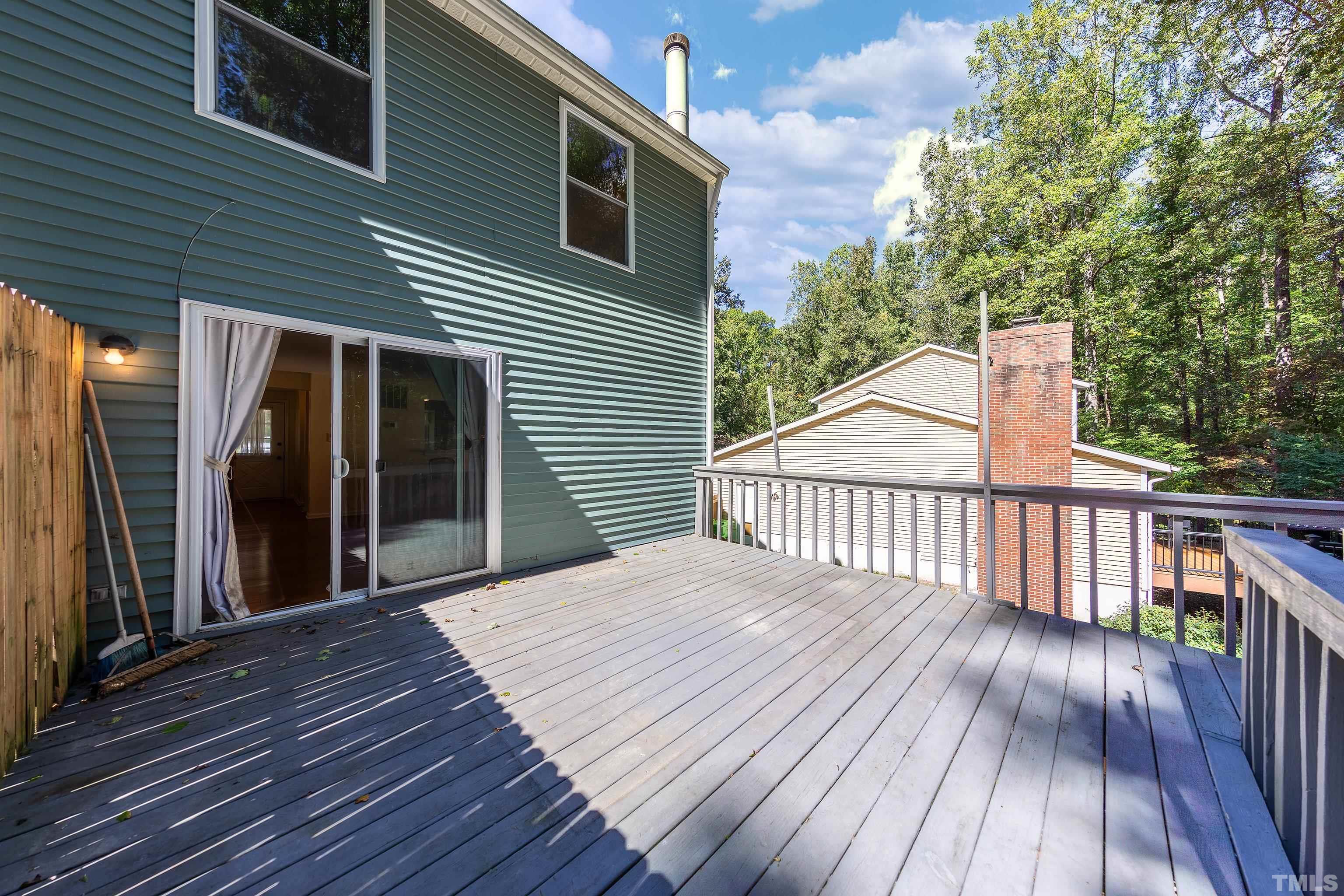 7328 Summerland Drive Raleigh, NC 27612 - Photo 19 of 22 a view of backyard with deck and wooden floor