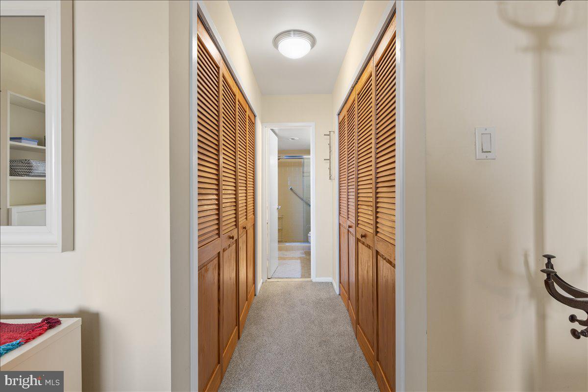 5101 River Road, Unit 1506 Bethesda, MD 20816 - Photo 20 of 37 a view of a hallway with wooden floor and staircase