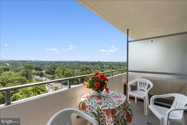 a view of a balcony with furniture