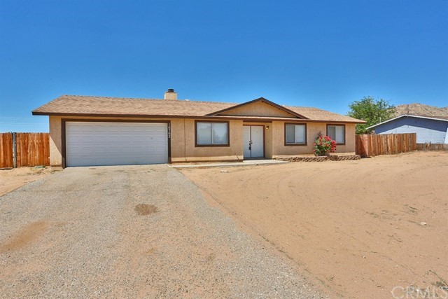 16762 Pauhaska Road Apple Valley, CA 92307 - Photo 1 of 1 a front view of a house with a yard