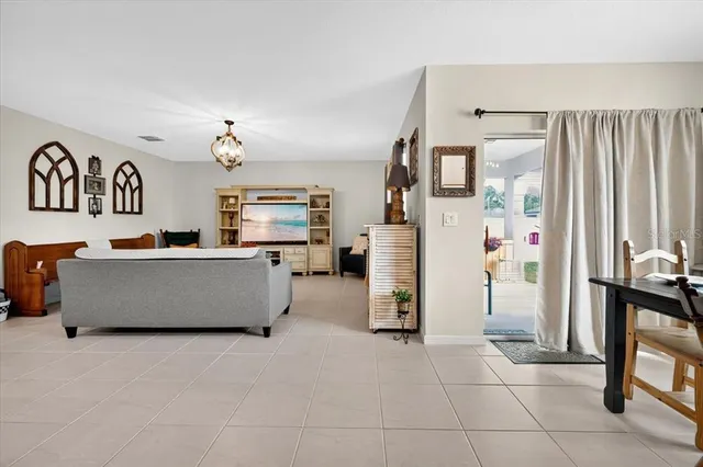 a view of kitchen with furniture and refrigerator