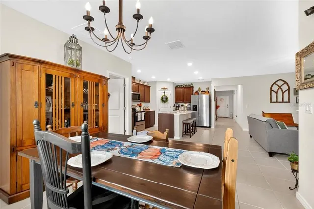 a dining room with furniture and wooden floor